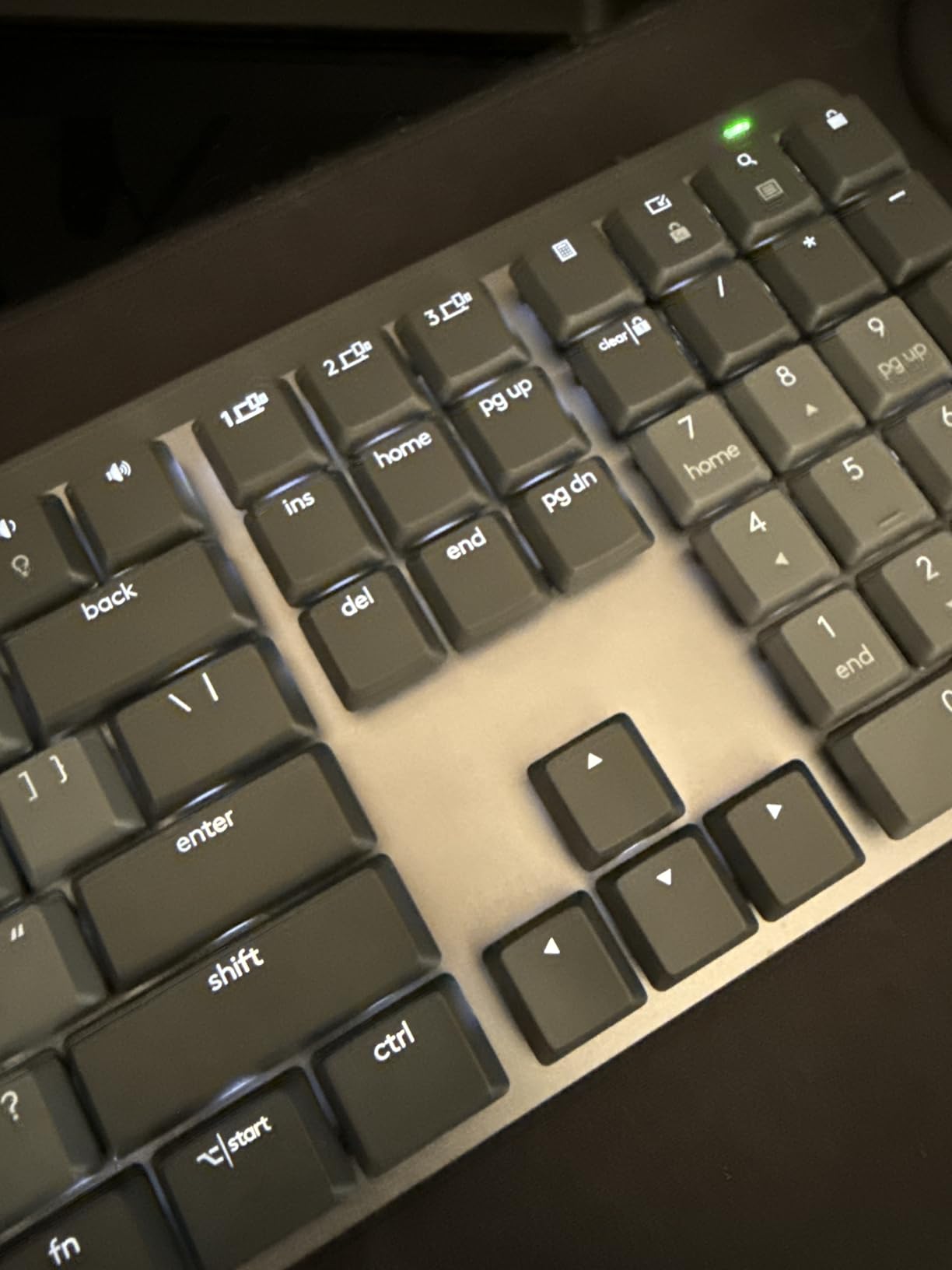 Logitech MX Mechanical Wireless Illuminated Keyboard Tactile - Graphite | Low-profile full-size, 3 device Bluetooth pairing, Smart backlight auto-adjusts, USB-C rechargeable, Up to 15 day battery customer photo 1